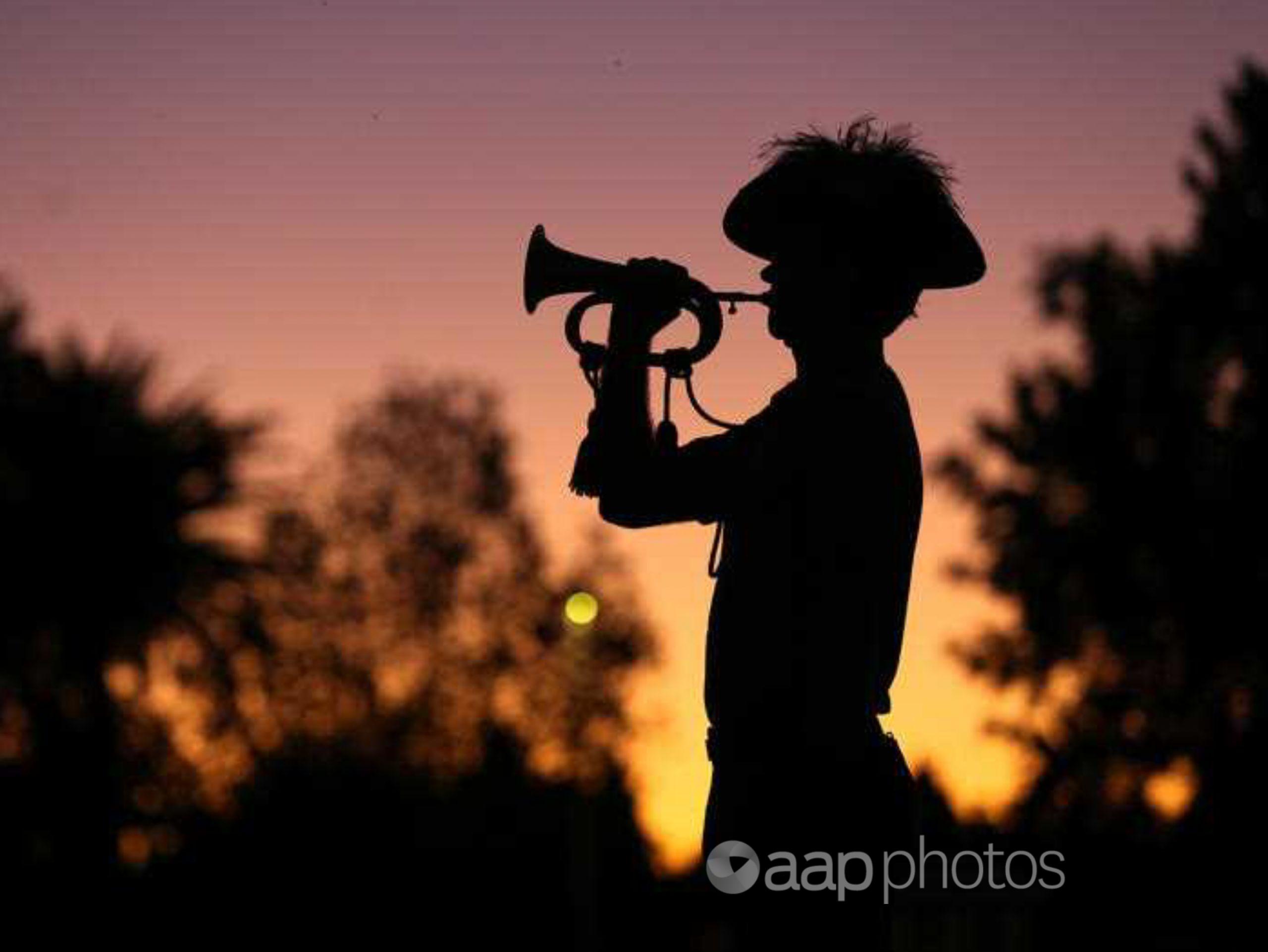 A bugler plays the Last Post