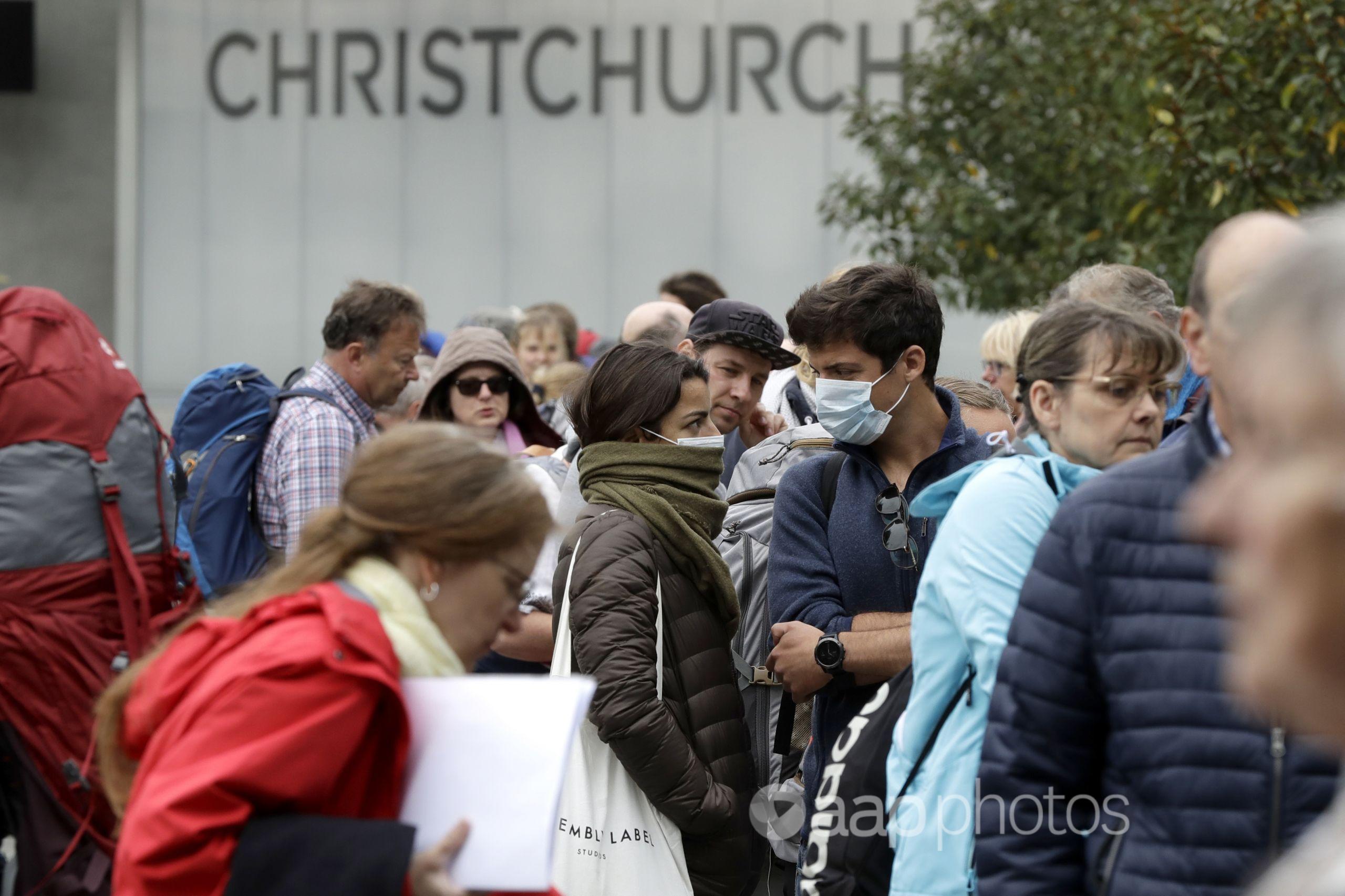 People line-up outside Christchurch Airport.