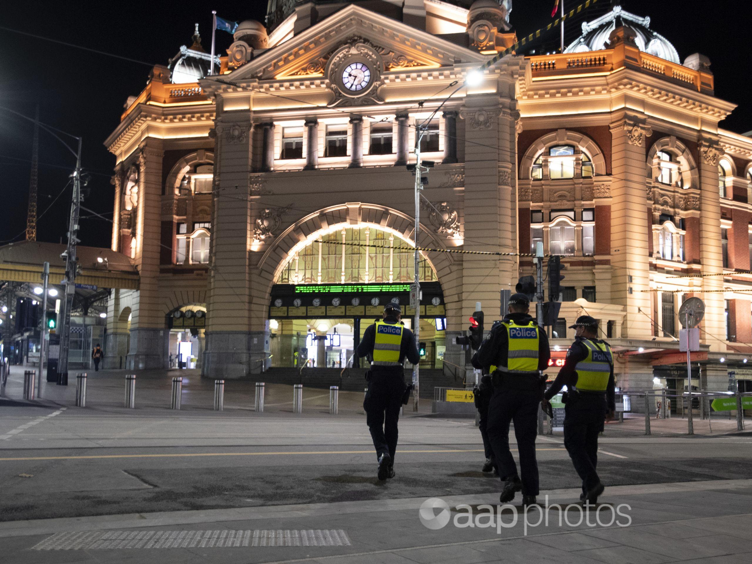 Police patrol Melbourne's Flinders Street station.