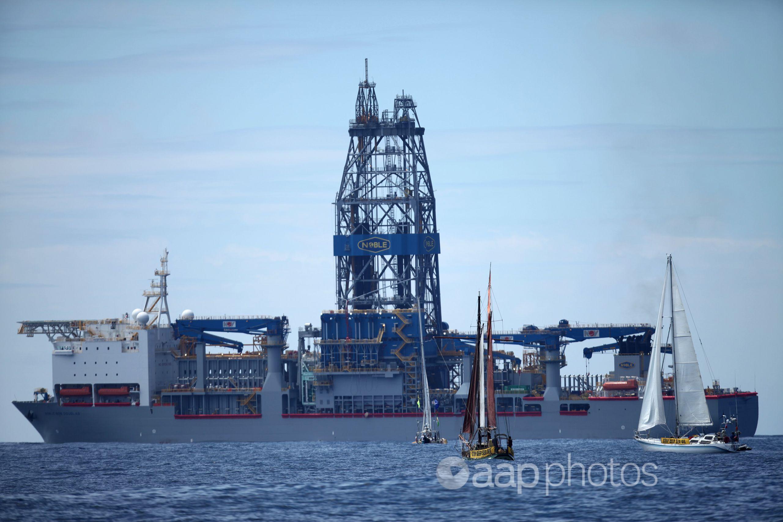 Protest yachts confront the Noble Bob Douglas drilling ship