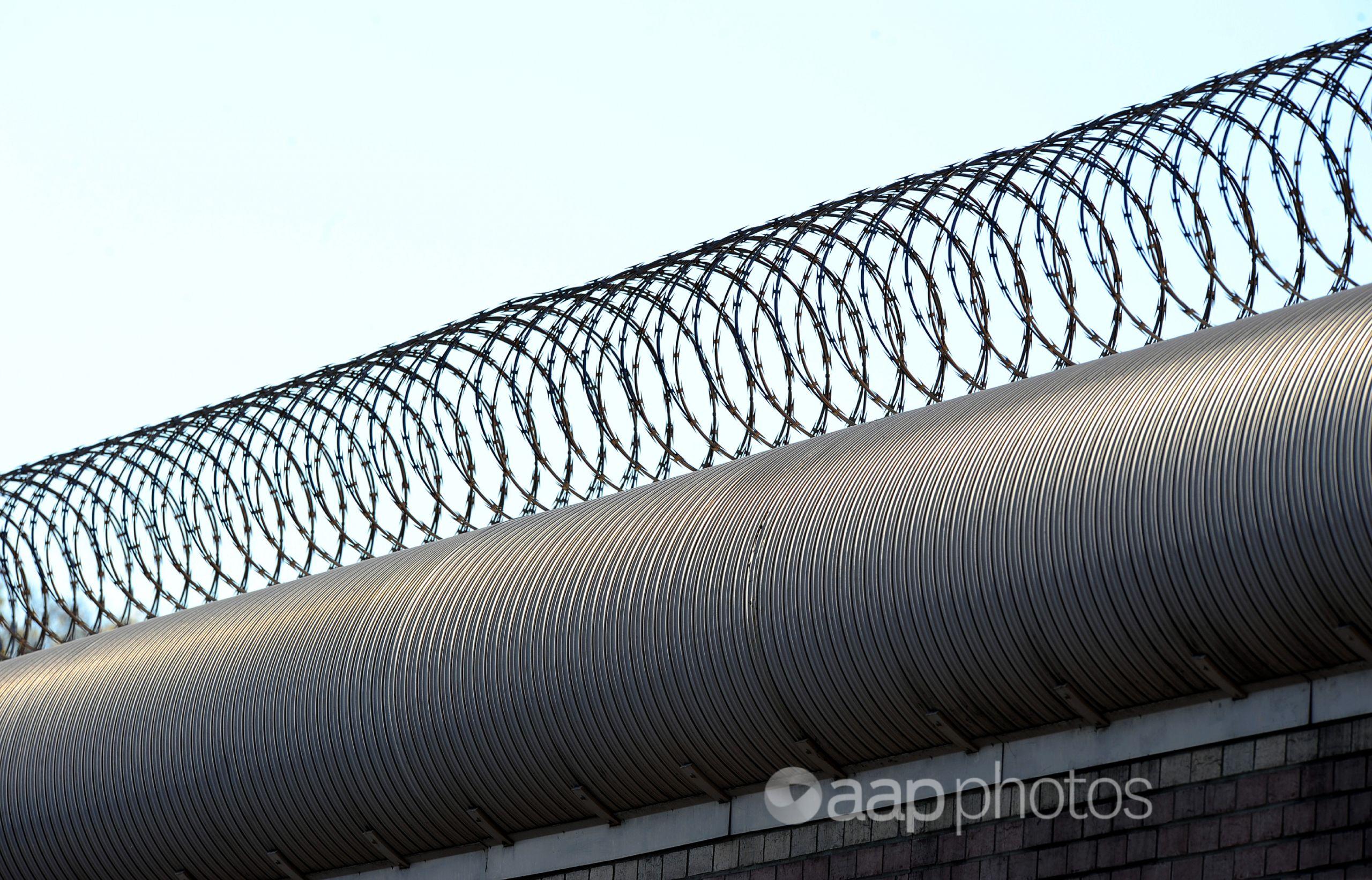 Razor wire on top of a prison fence