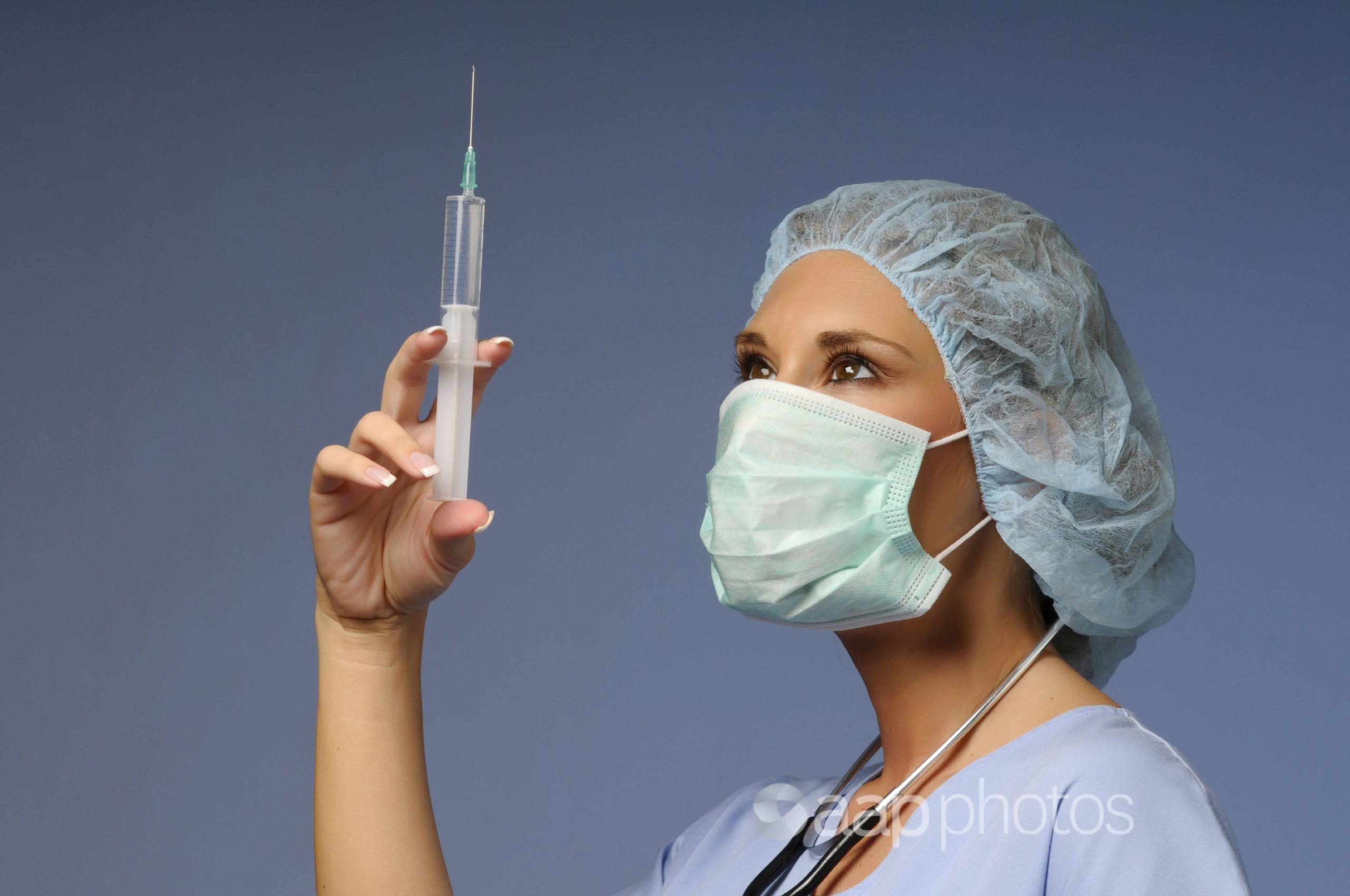 Nurse holding syringe