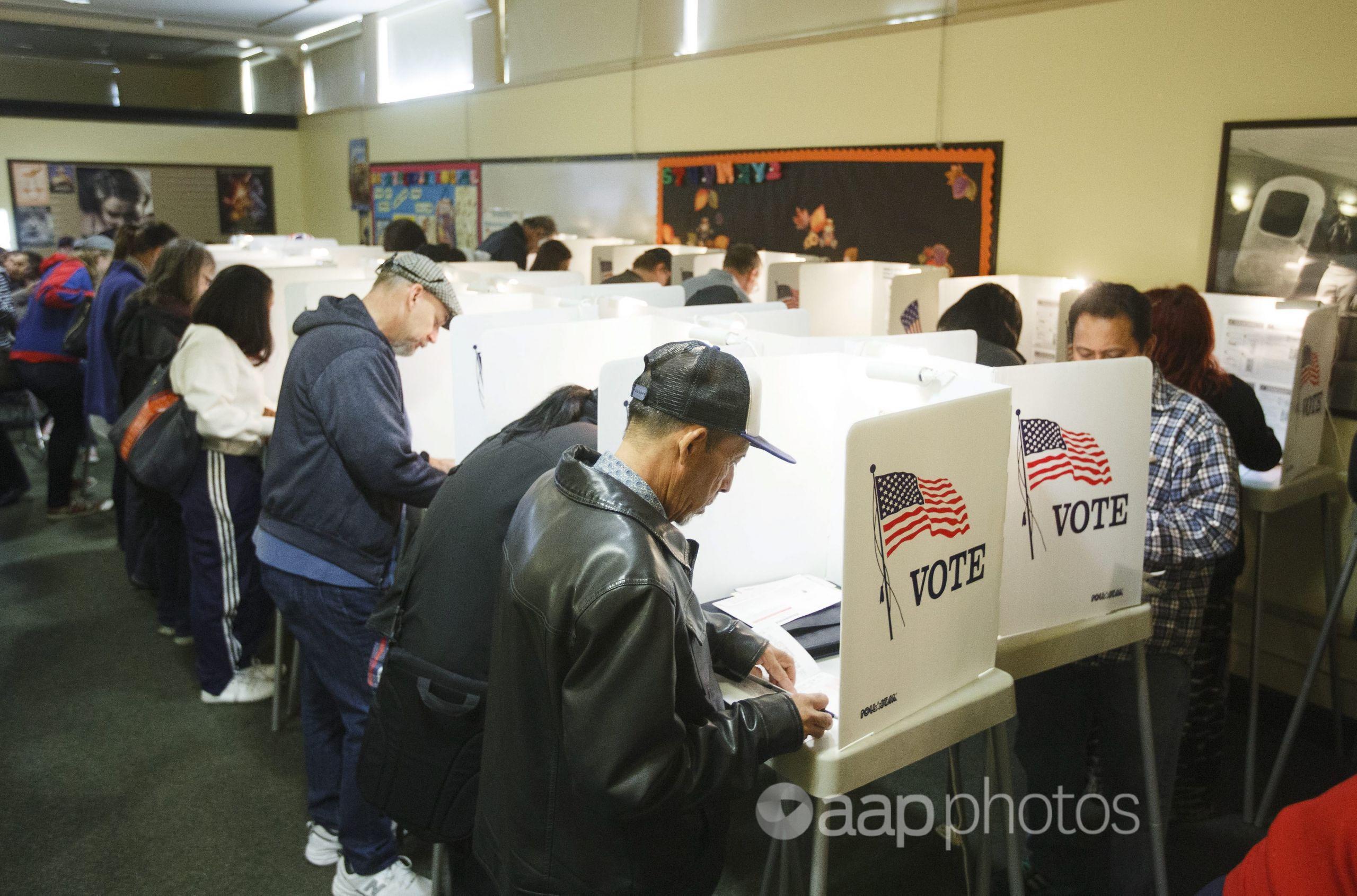 Voters cast their US Presidential ballots