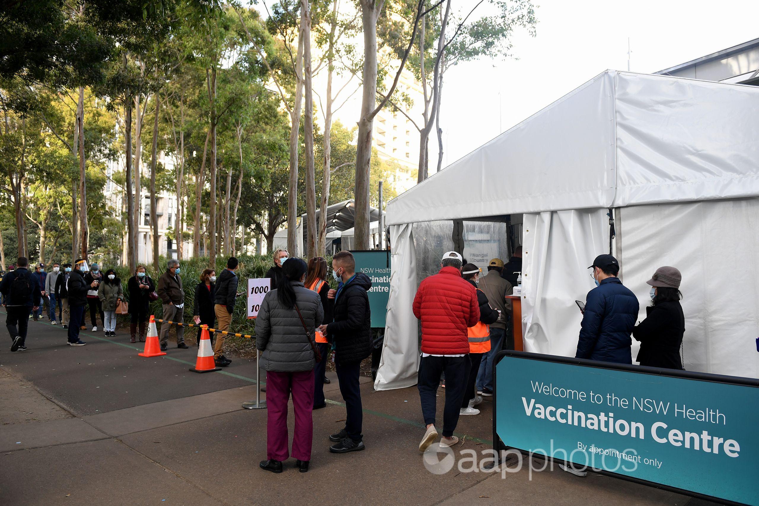 People lining up at the mass vaccination hub at Sydney's Olympic Park