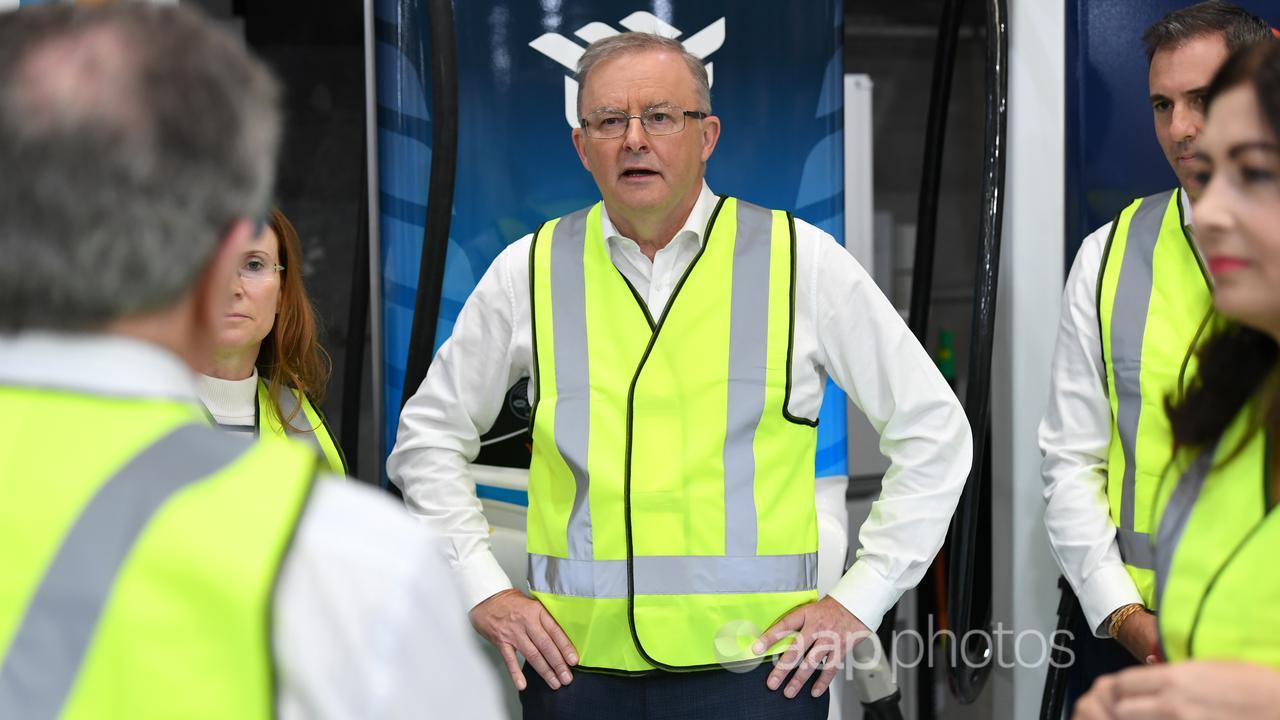 Anthony Albanese (centre) visits a factory in Brisbane (file image)