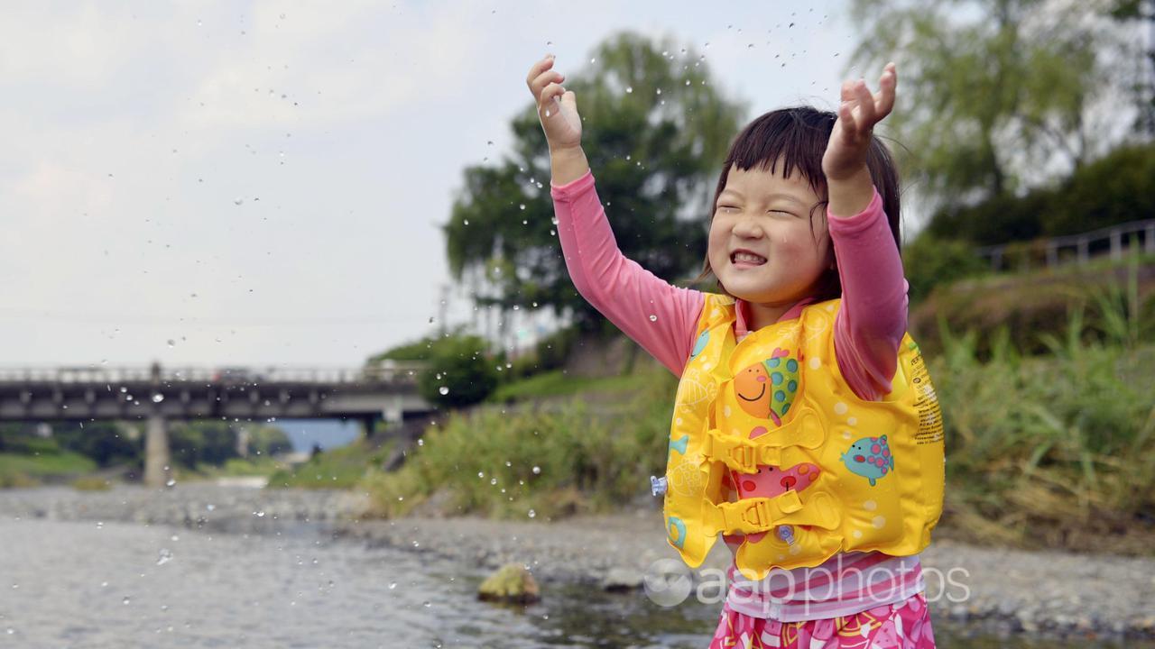 A child plays in a river in Kyoto (file image)