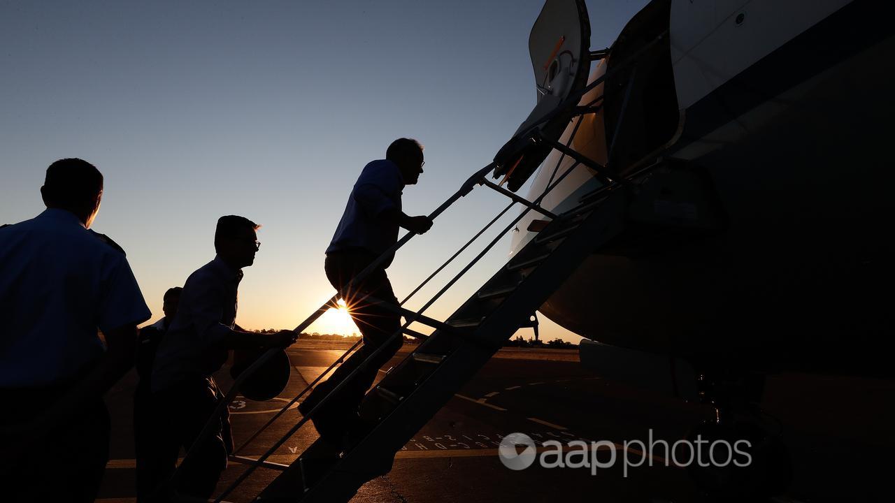 David Littleproud and Prime Minister Scott Morrison board a plane.