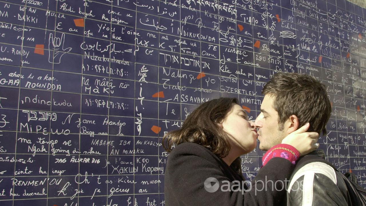 A French couple kissing.