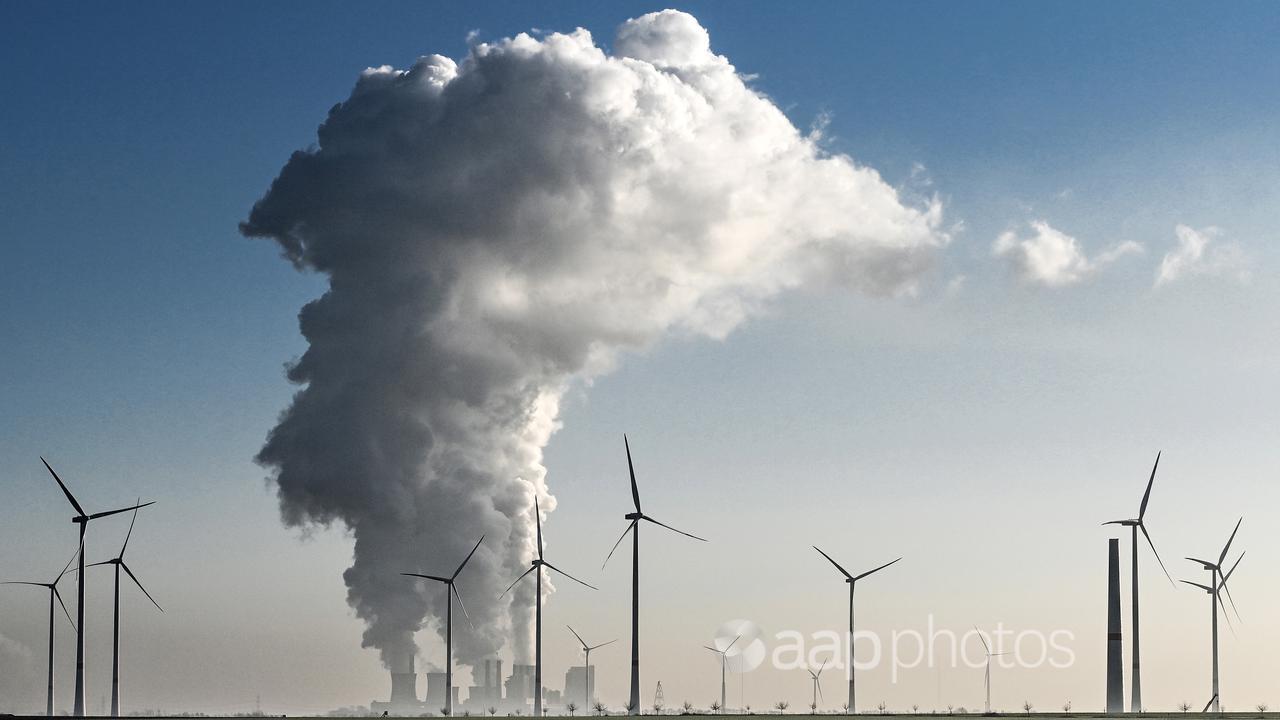 Wind turbines next to a coal-fired plant near Grevenbroich, Germany.