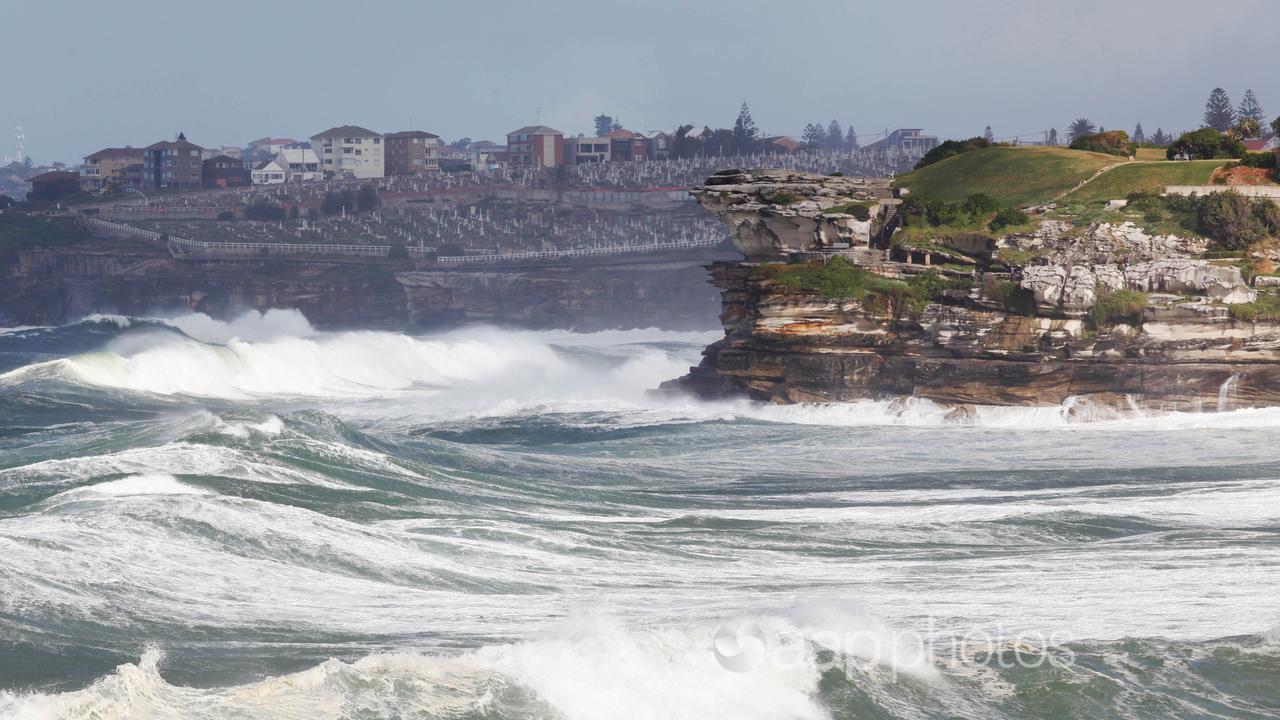 A king tide and huge surf pound the coast in Sydney.