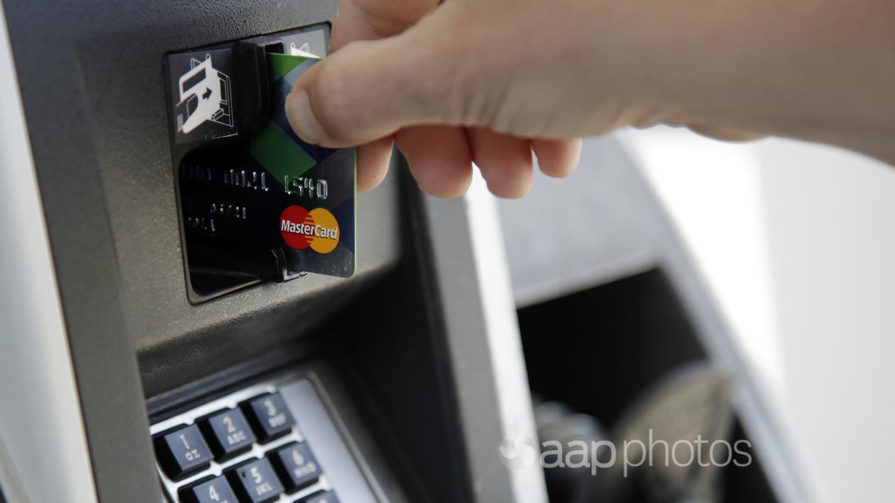 A customer inserts a credit card