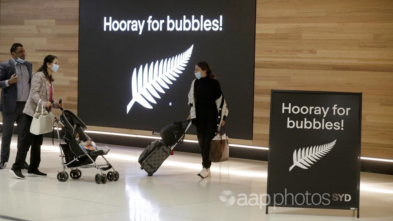 Passengers prepare to fly to New Zealand.