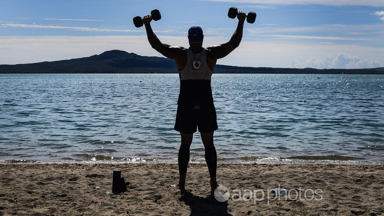 A man lifts weights at Kohi Beach in Auckland (file image)