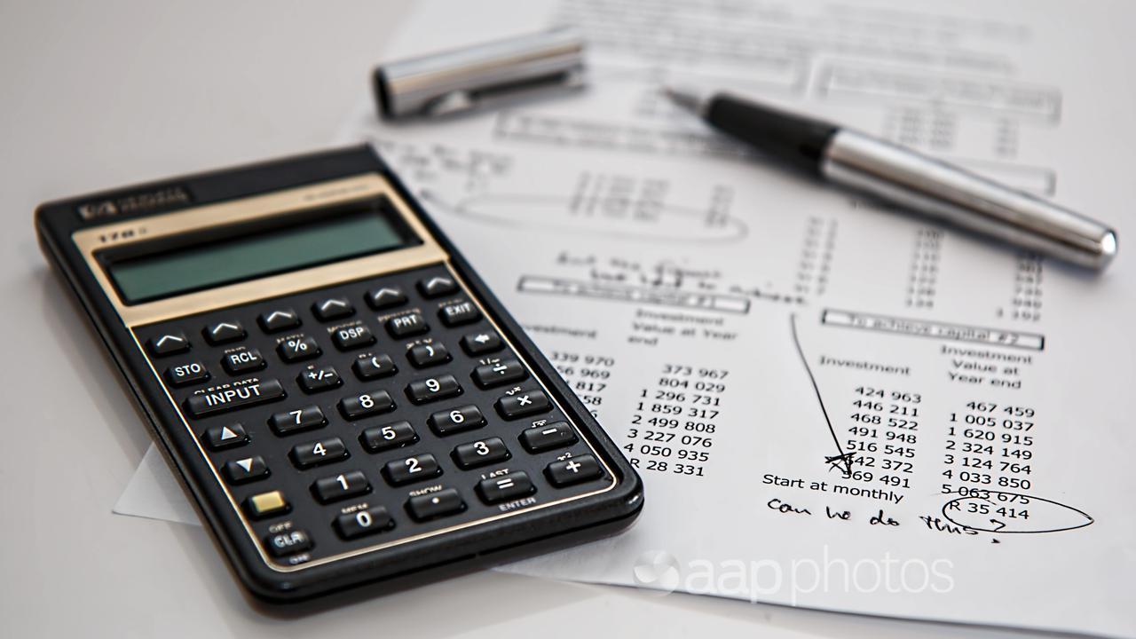 A calculator and a pen (file image)