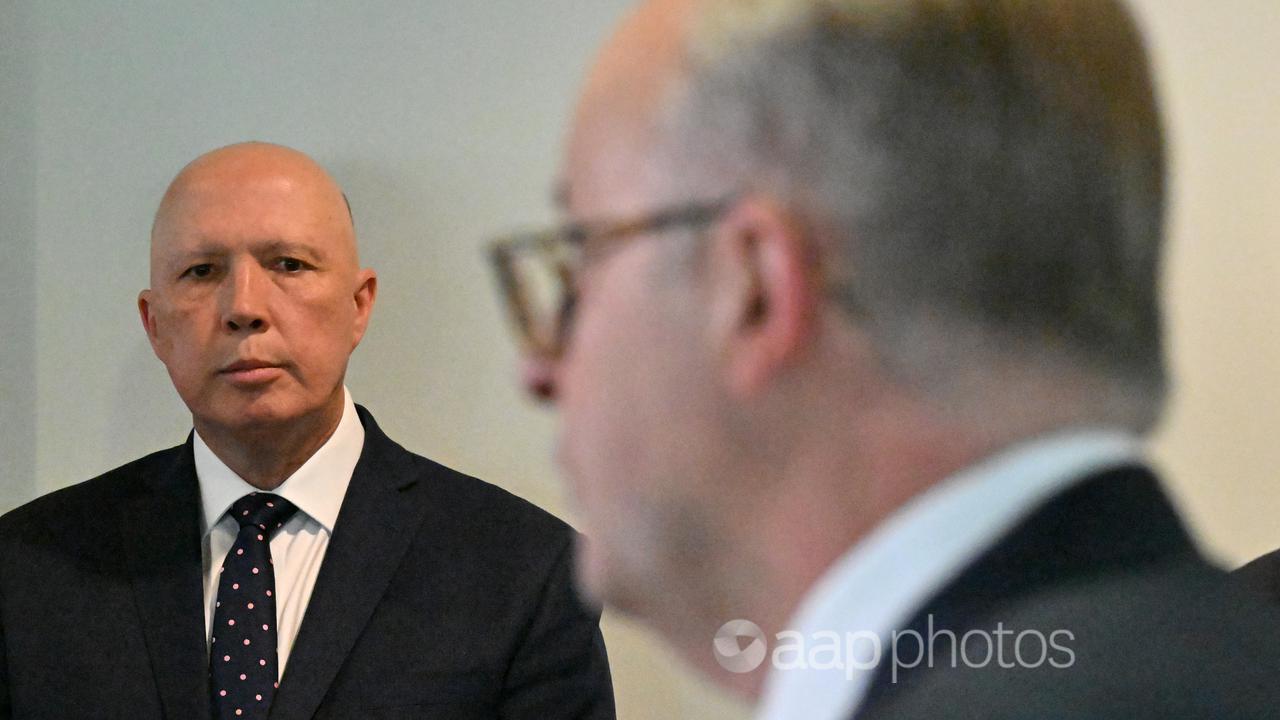 Peter Dutton (left) watches Anthony Albanese (file image)