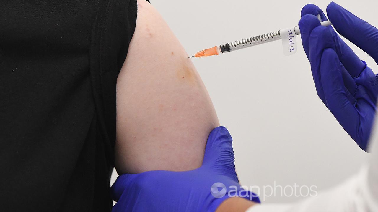A woman receives a COVID-19 vaccine