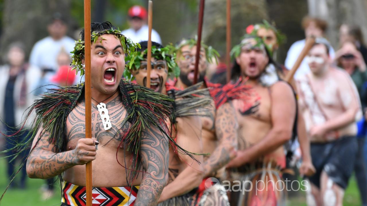 Maori men perform a haka at an Anzac Day service