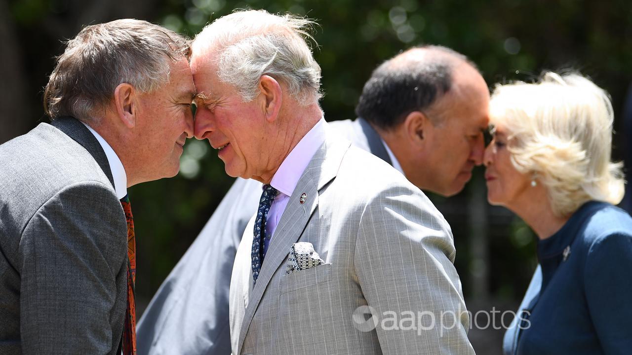 The now king and queen received the traditional Maori greeting