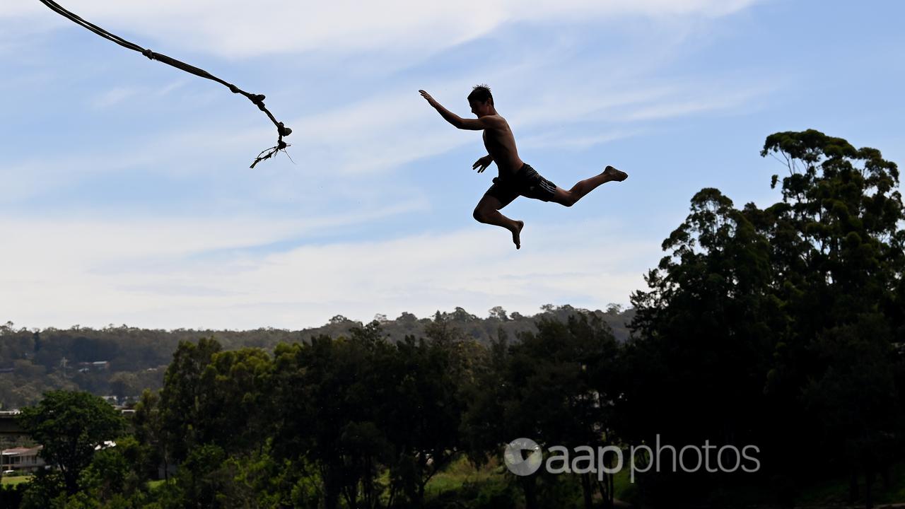 A person on a rope swing at the Nepean River near Penrith