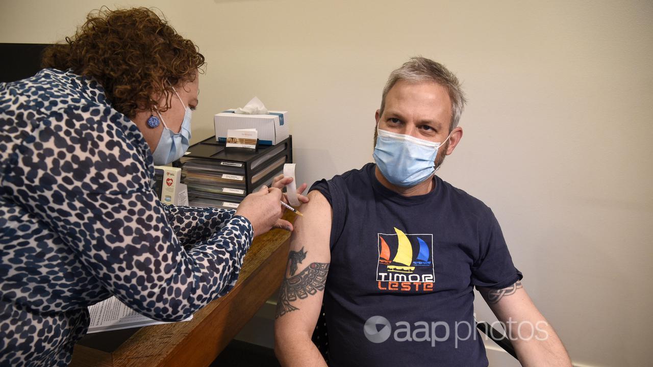 Brett Sutton receives a COVID-19 vaccination (file image)
