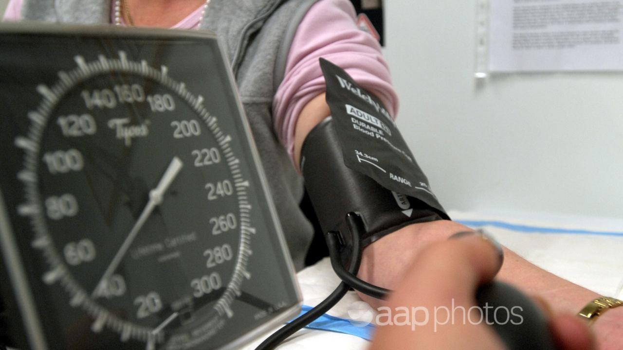 A patient has her blood pressure checked (file image)