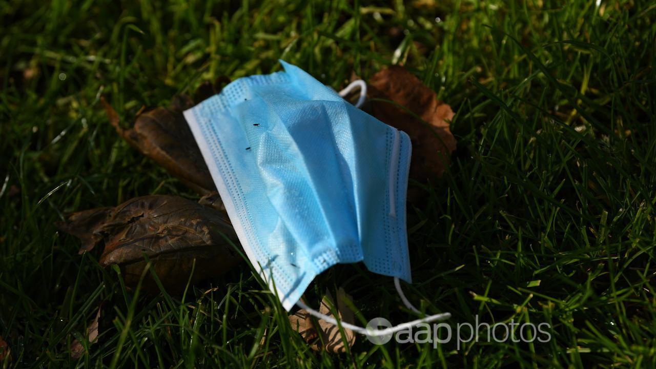 A discarded single use face mask (file image)