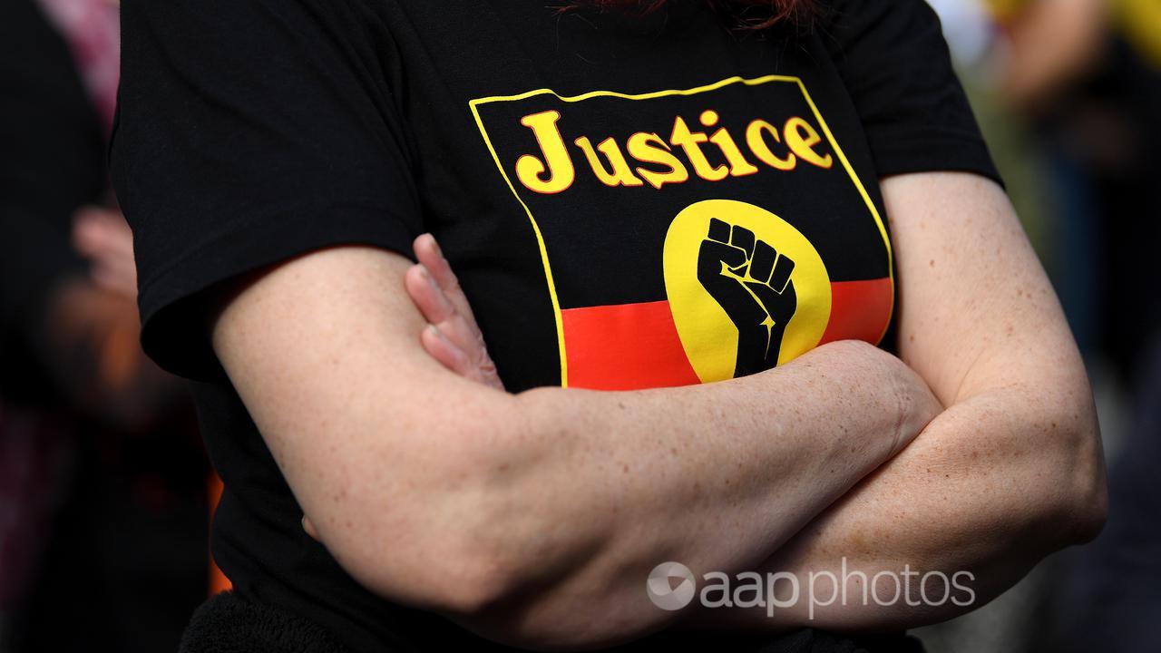 A protesters at an Indigenous deaths in custody rally (file image)