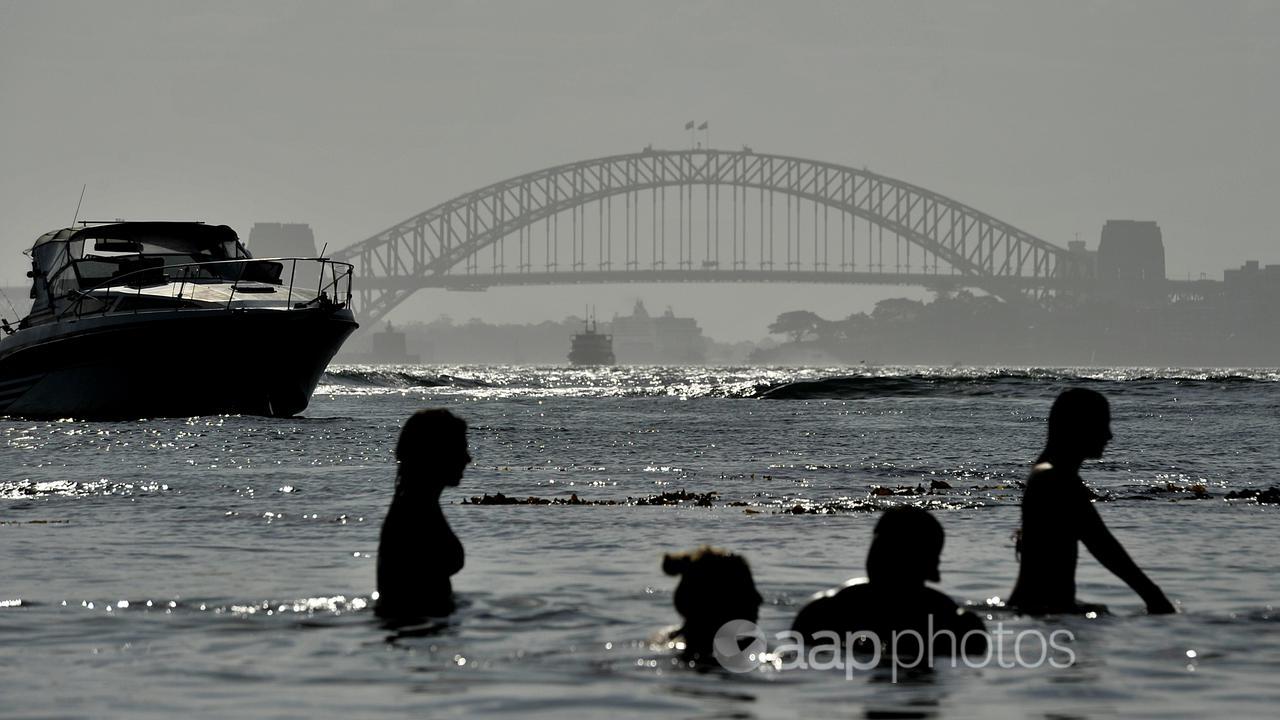 People in the water at Milk Beach in Sydney