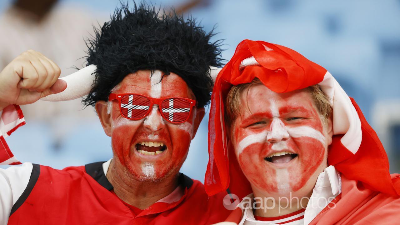 People with faces painted in colours of the Danish flag (file image)
