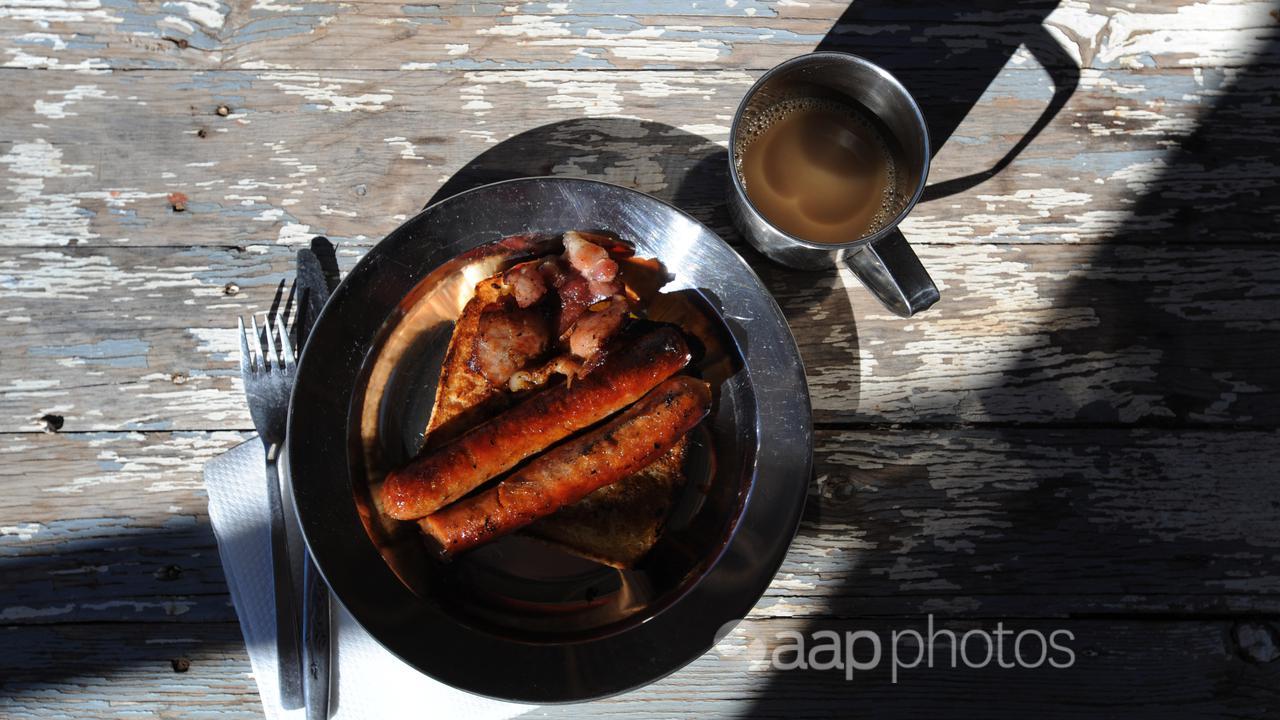 Sausages and bacon on a plate (file image)
