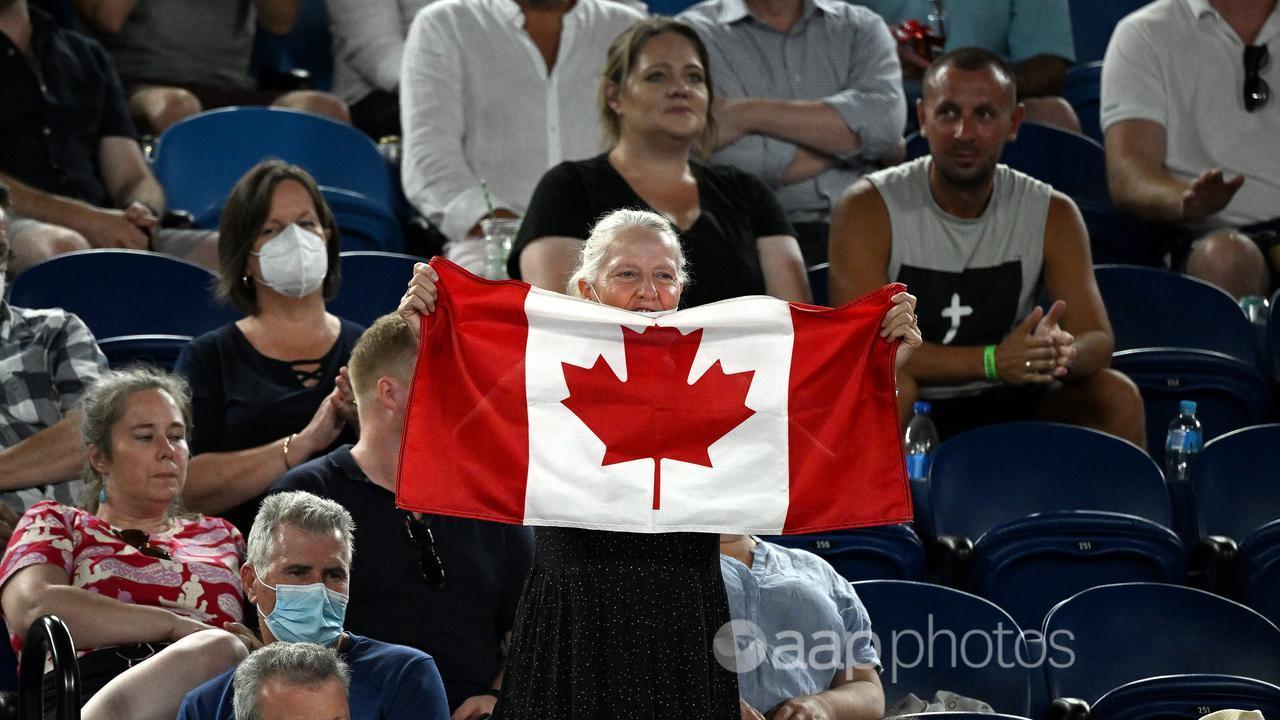 A tennis fan displays a Canadian flag during the Australian Open