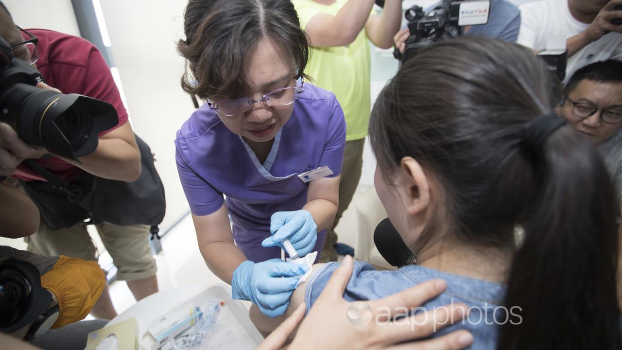A Beijing woman was the first vaccine recipient back in May 2018.
