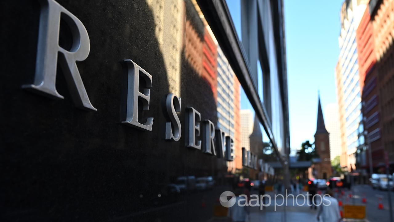 People walk past the Reserve Bank of Australia in Sydney