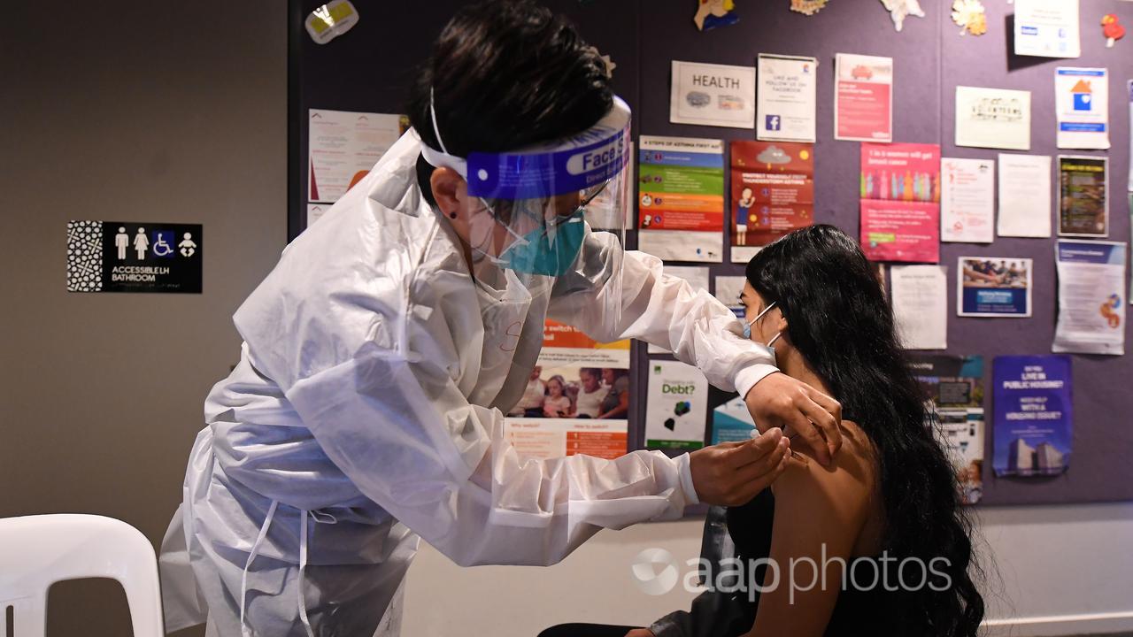 A healthcare worker gives a vaccination (file image)
