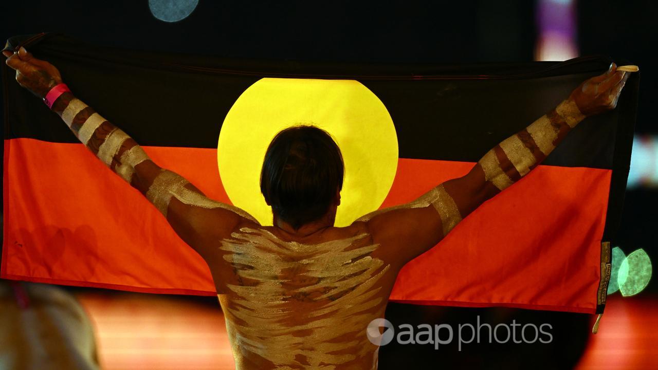 An Indigenous performer with a flag (file image)