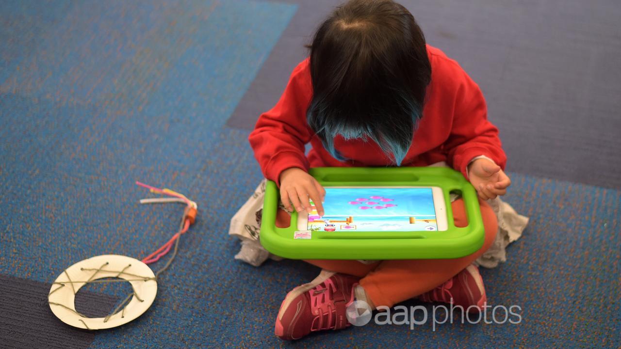 A child plays on an iPad (file image)