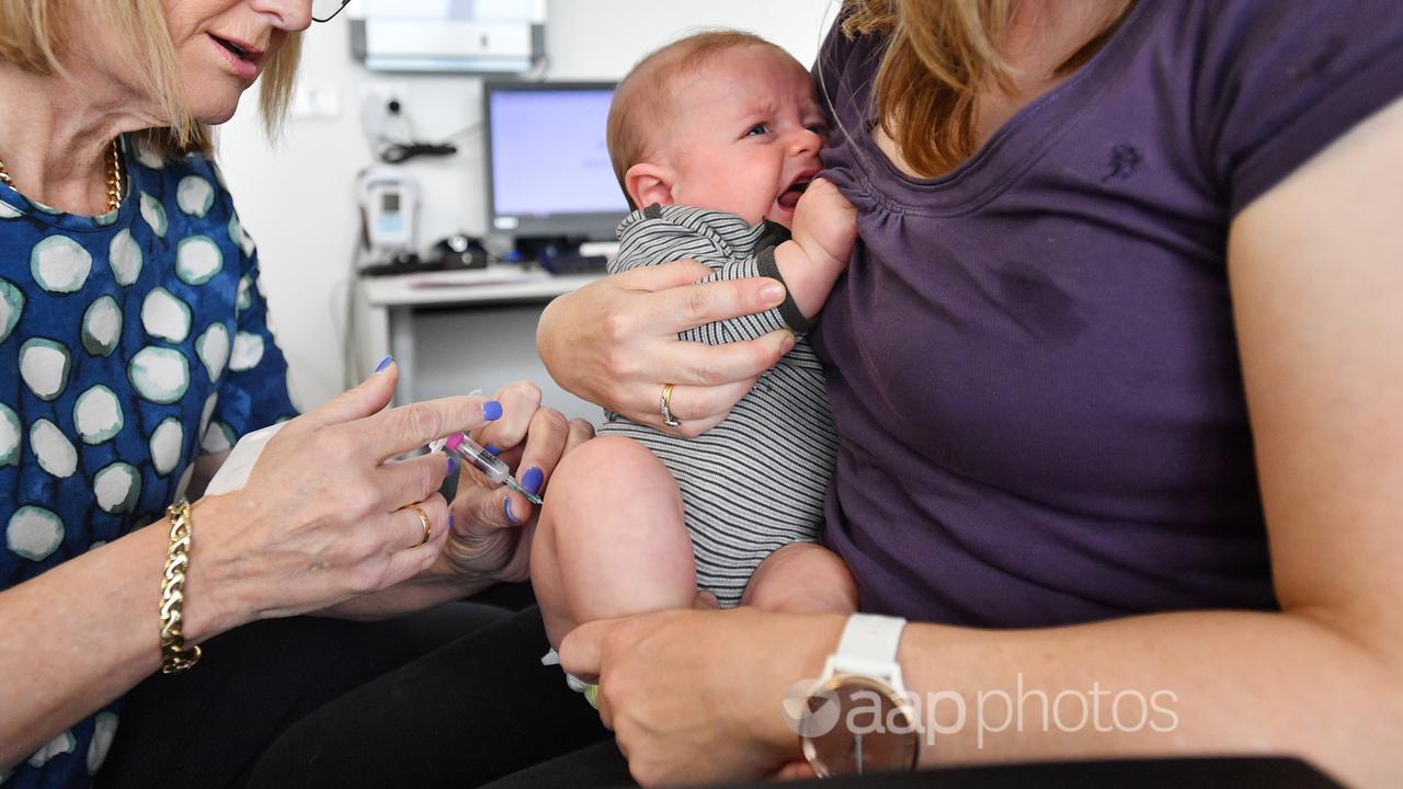 A baby receives a Meningococcal B vaccine (file image)