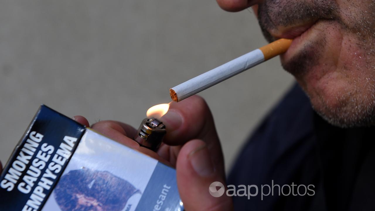 A man lighting a cigarette (file image)