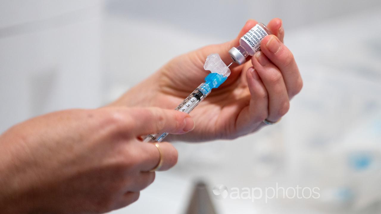 A health worker prepares a COVID-19 vaccine (file image)