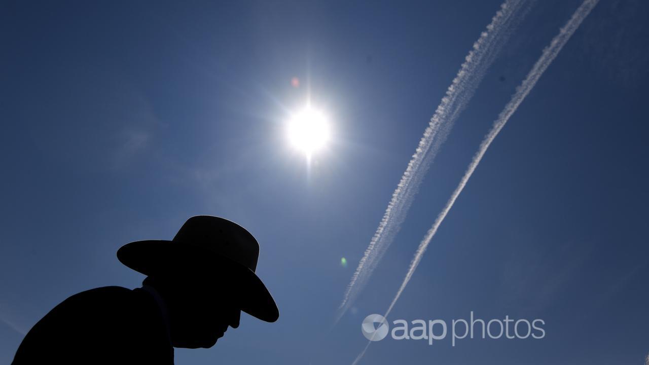 A plane's contrails above Canberra (file image)