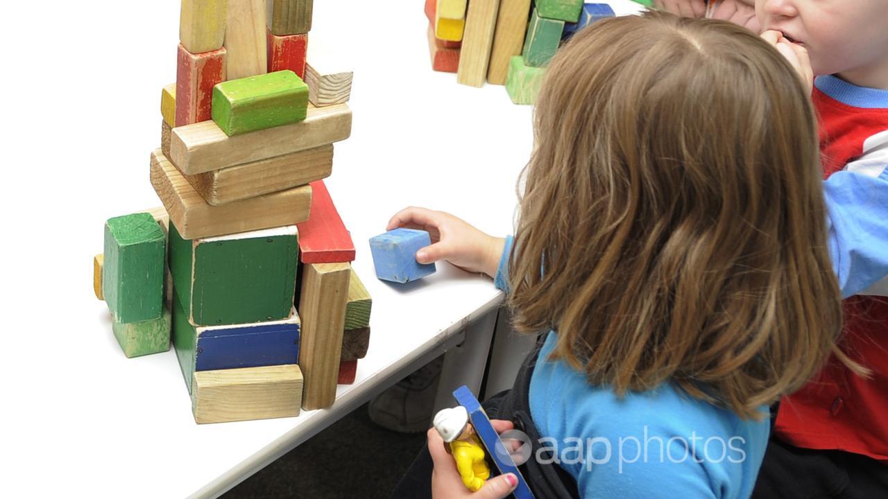 Children play with toys at a preschool (file image)