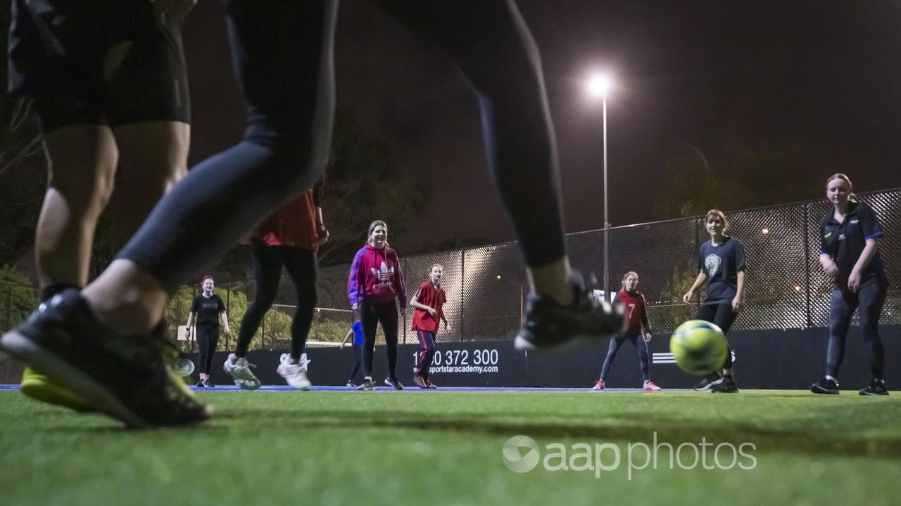 Bayside Futsal Women members play futsal in Melbourne.