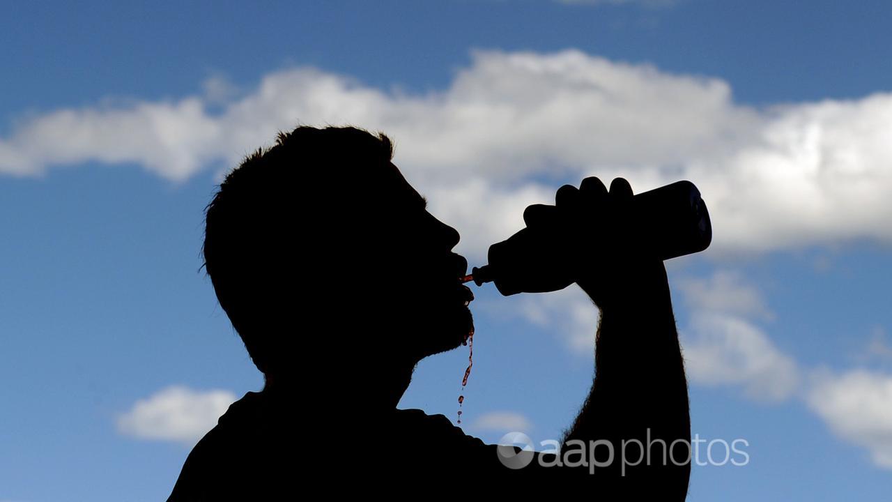 A person drinking from a water bottle (file image)