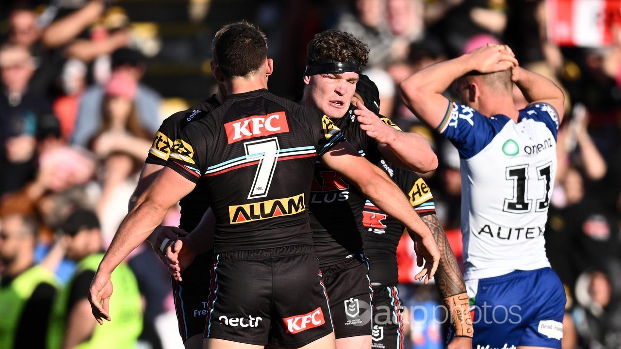 Liam Martin (r) celebrates a try for Penrith against the Warriors.