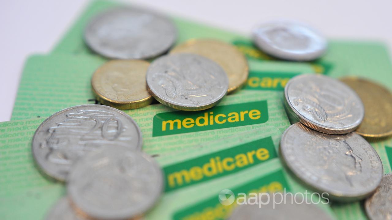 Medicare healthcare cards and coins (file image)