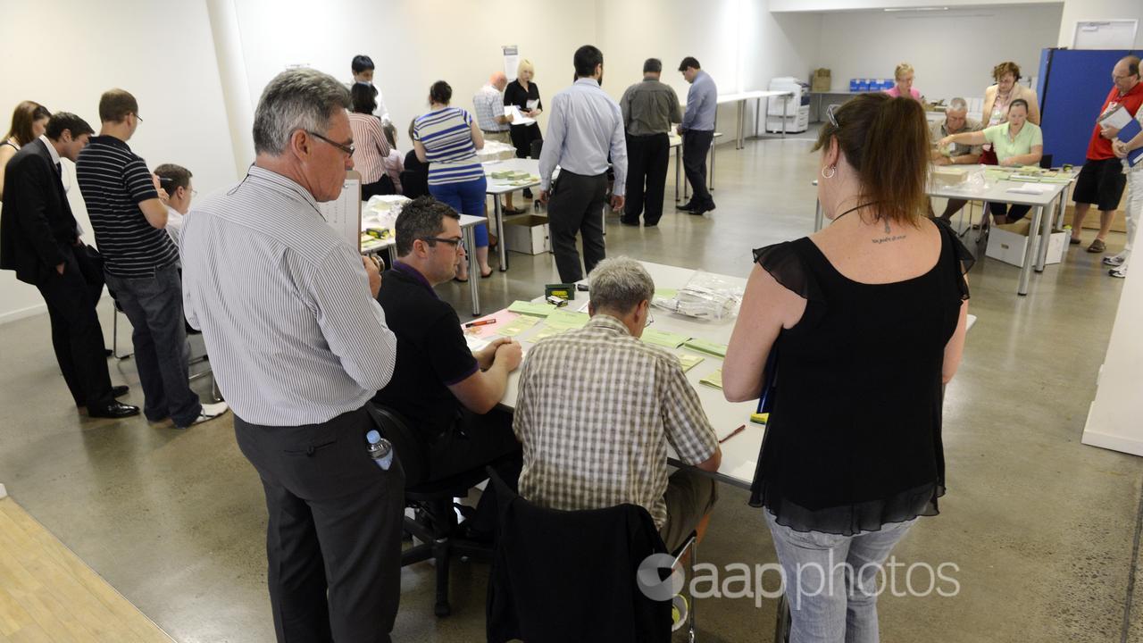 Scrutineers watch over as officials count votes (file image)