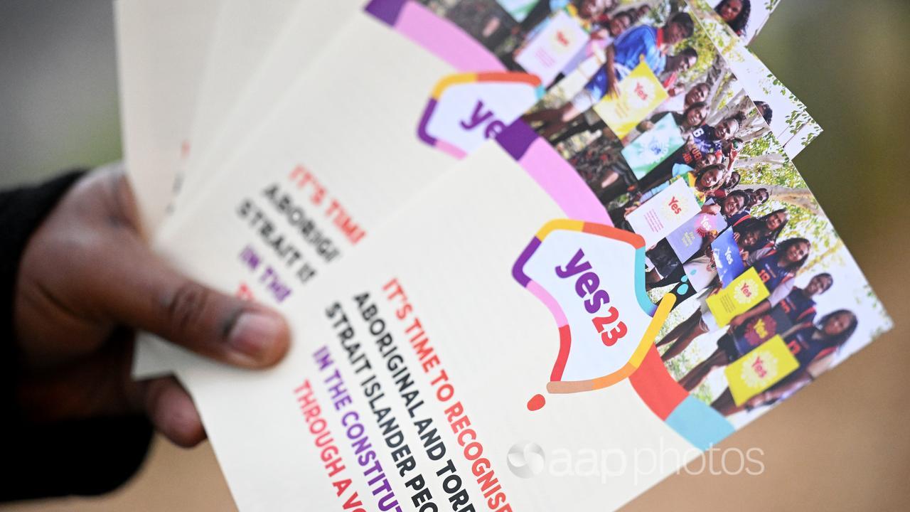 A Yes23 volunteer holds pamphlets (file image)