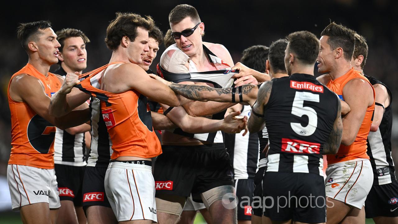 Collingwood and GWS players scuffle.