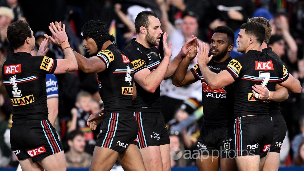 Penrith players celebrate against the Warriors.