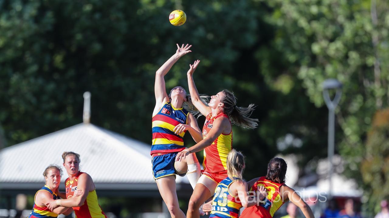 Adelaide's Montana McKinnon contests the ball against the AFLW Suns.